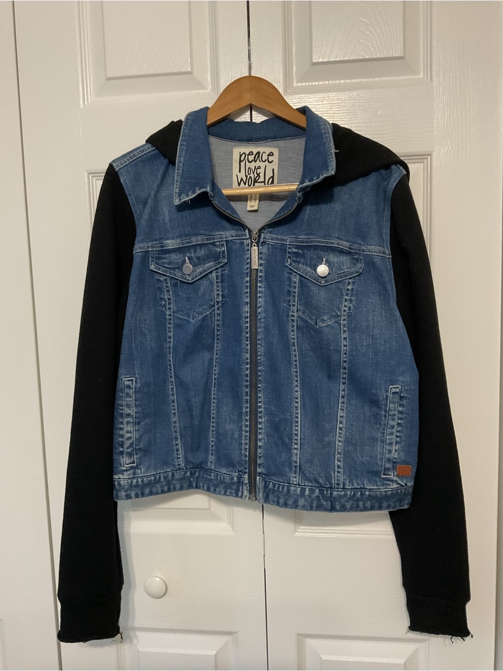 Peace Love World women’s Blue Denim Jacket with Black Hoodie Sleeves